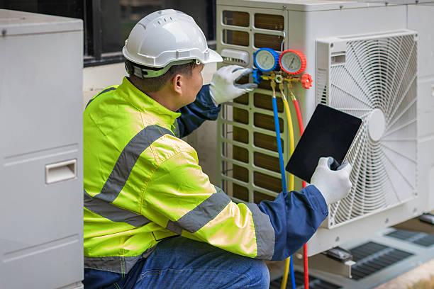 Professional Air Conditioning Repair technician working in Newport, OR